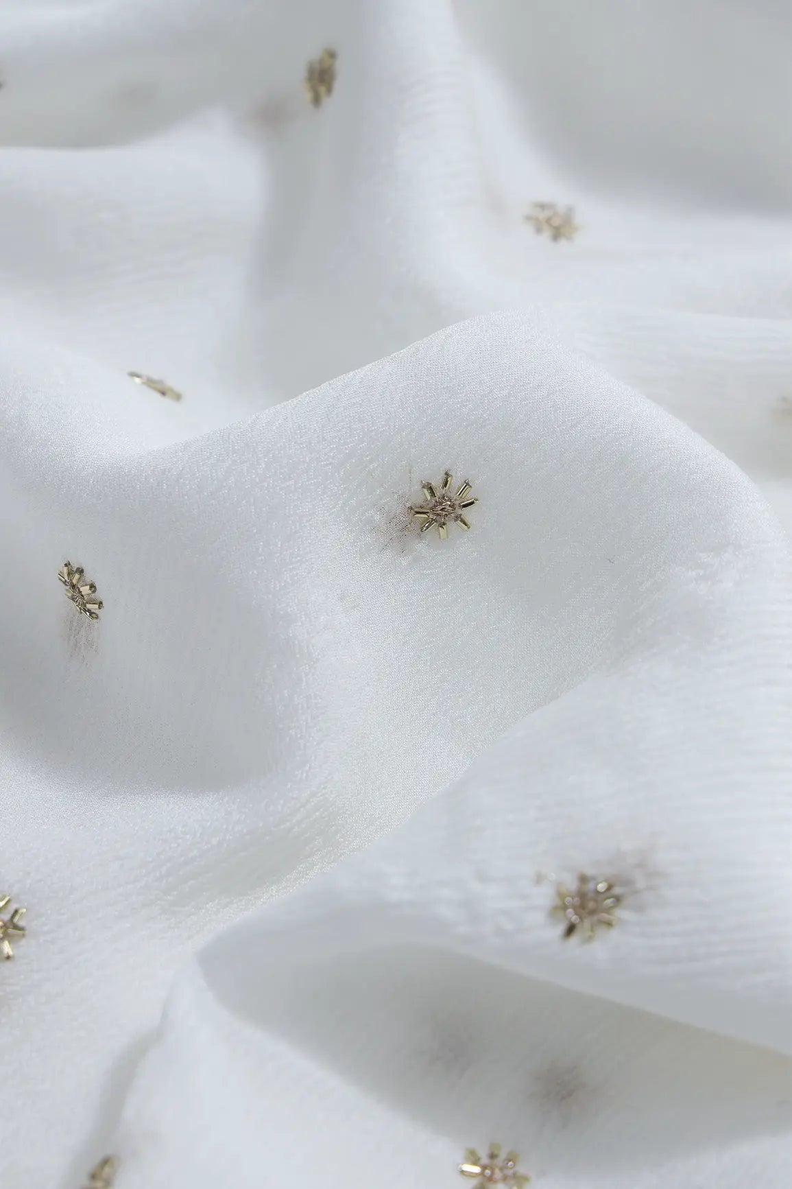 AIzaSyBcstauz-XMPRhEY21AUzeo032pxrXB5Ug - Gold Beads Cut Dana Motif Embroidery Work On White Dyeable Chinnon Chiffon Fabric