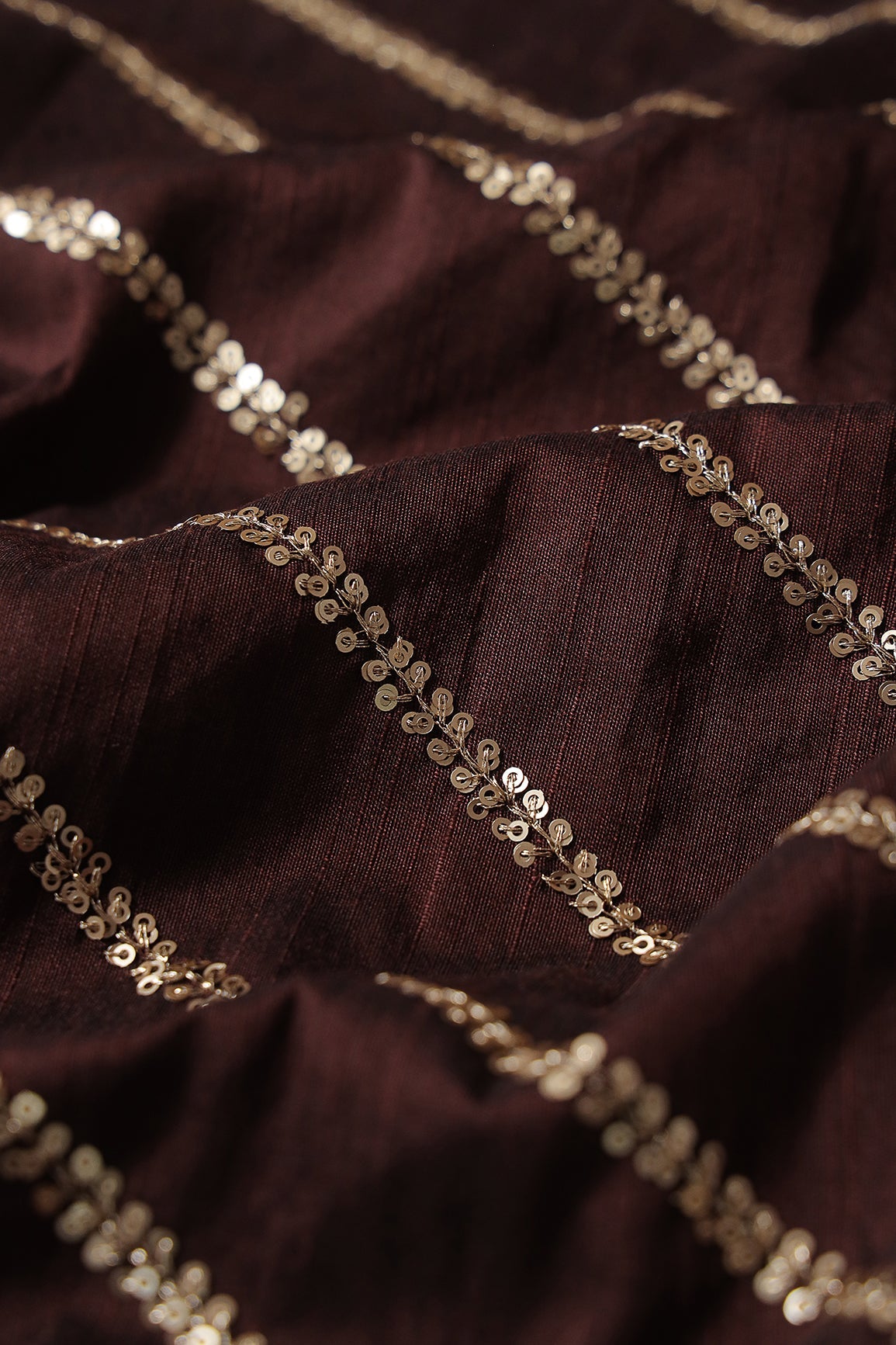 AIzaSyBcstauz-XMPRhEY21AUzeo032pxrXB5Ug - Gold Sequins With Gold Zari Stripes Embroidery Work On Brown Raw Silk Fabric