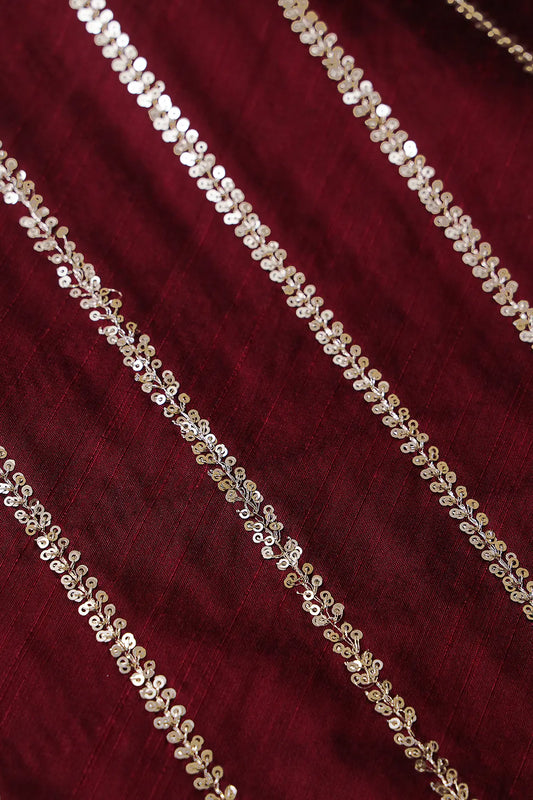 AIzaSyBcstauz-XMPRhEY21AUzeo032pxrXB5Ug - Gold Sequins With Gold Zari Stripes Embroidery Work On Dark Maroon Raw Silk Fabric