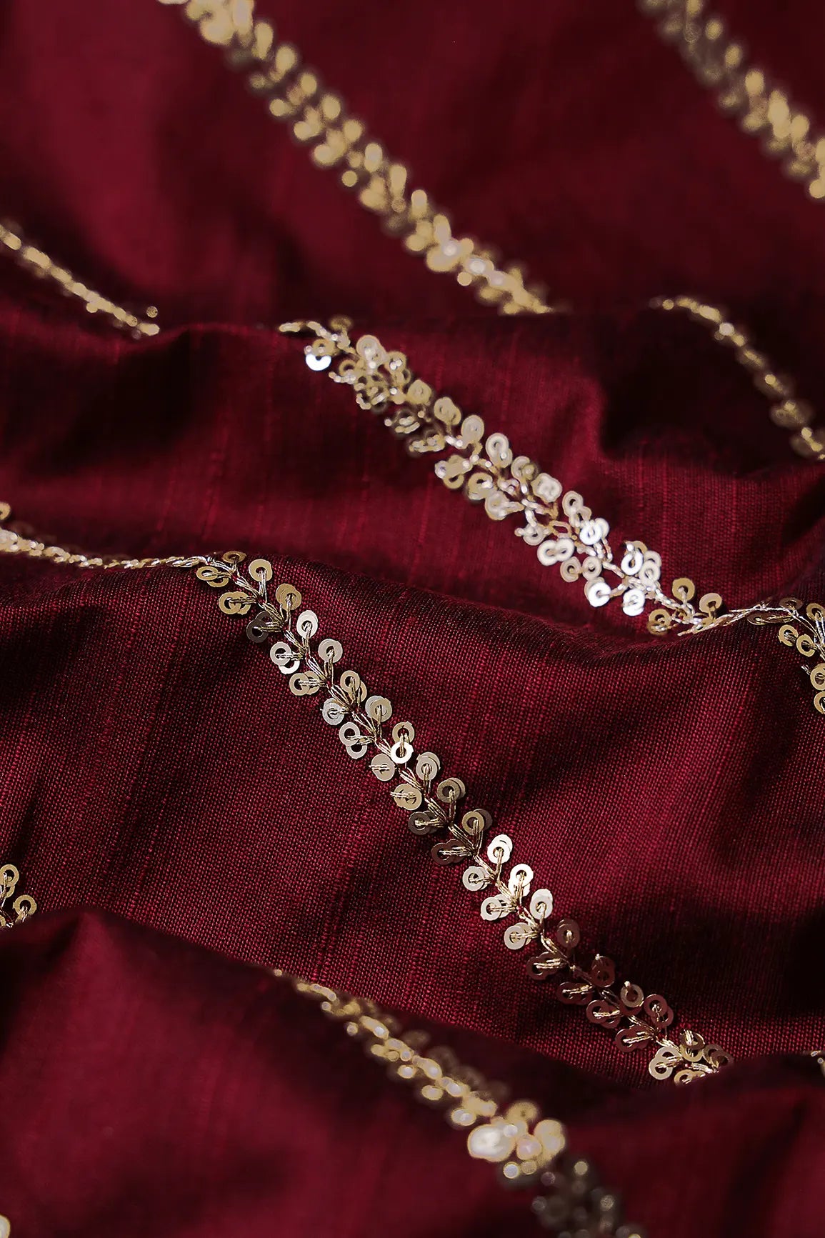 AIzaSyBcstauz-XMPRhEY21AUzeo032pxrXB5Ug - Gold Sequins With Gold Zari Stripes Embroidery Work On Dark Maroon Raw Silk Fabric