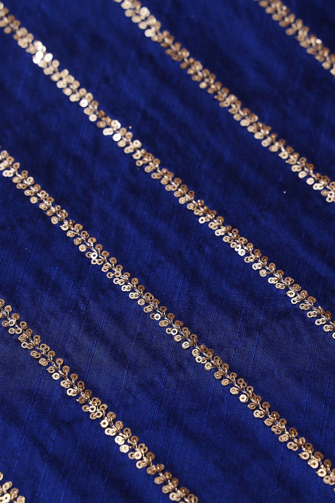 AIzaSyBcstauz-XMPRhEY21AUzeo032pxrXB5Ug - Gold Sequins With Gold Zari Stripes Embroidery Work On Royal Blue Raw Silk Fabric
