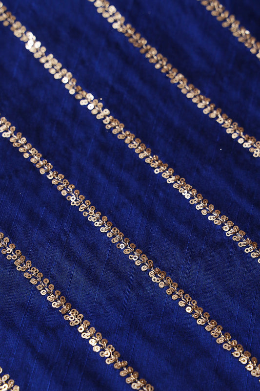 AIzaSyBcstauz-XMPRhEY21AUzeo032pxrXB5Ug - Gold Sequins With Gold Zari Stripes Embroidery Work On Royal Blue Raw Silk Fabric