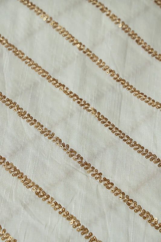 AIzaSyBcstauz-XMPRhEY21AUzeo032pxrXB5Ug - Gold Sequins With Gold Zari Stripes Embroidery Work On White Raw Silk Fabric