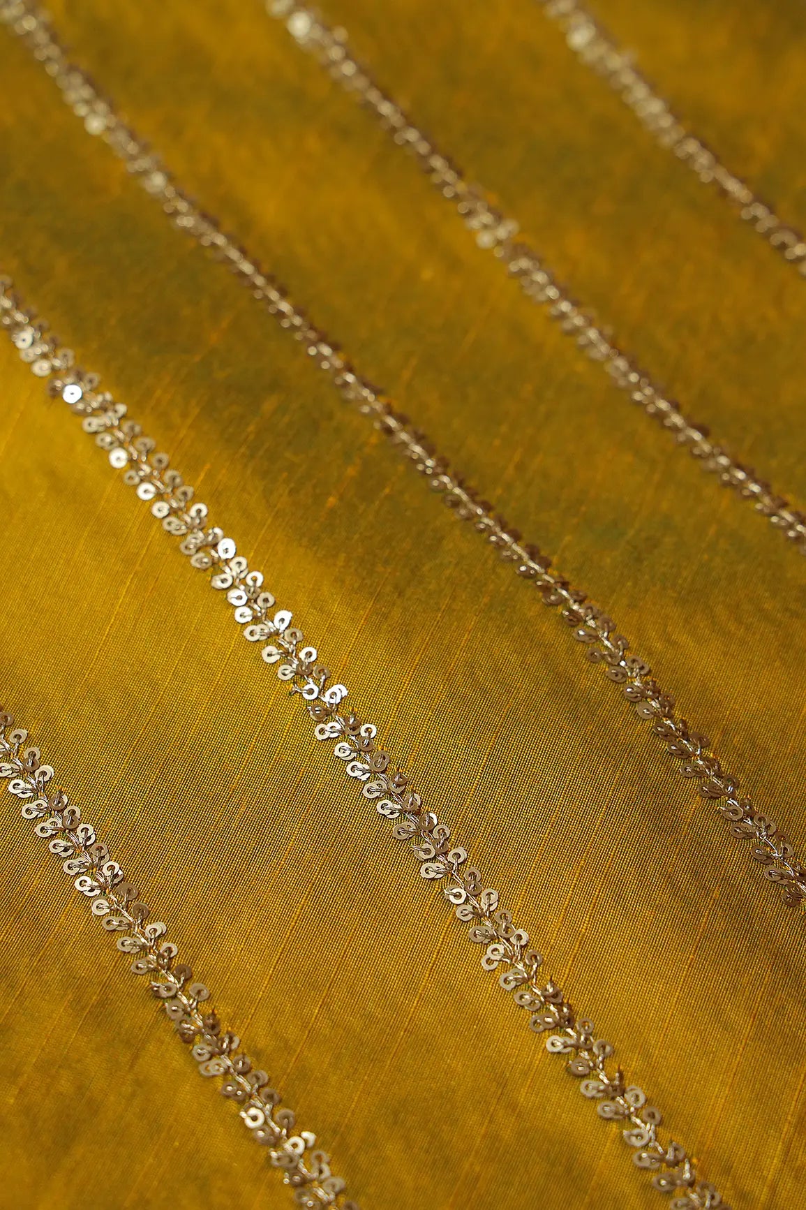 AIzaSyBcstauz-XMPRhEY21AUzeo032pxrXB5Ug - Gold Sequins With Gold Zari Stripes Embroidery Work On Dark Mustard Raw Silk Fabric