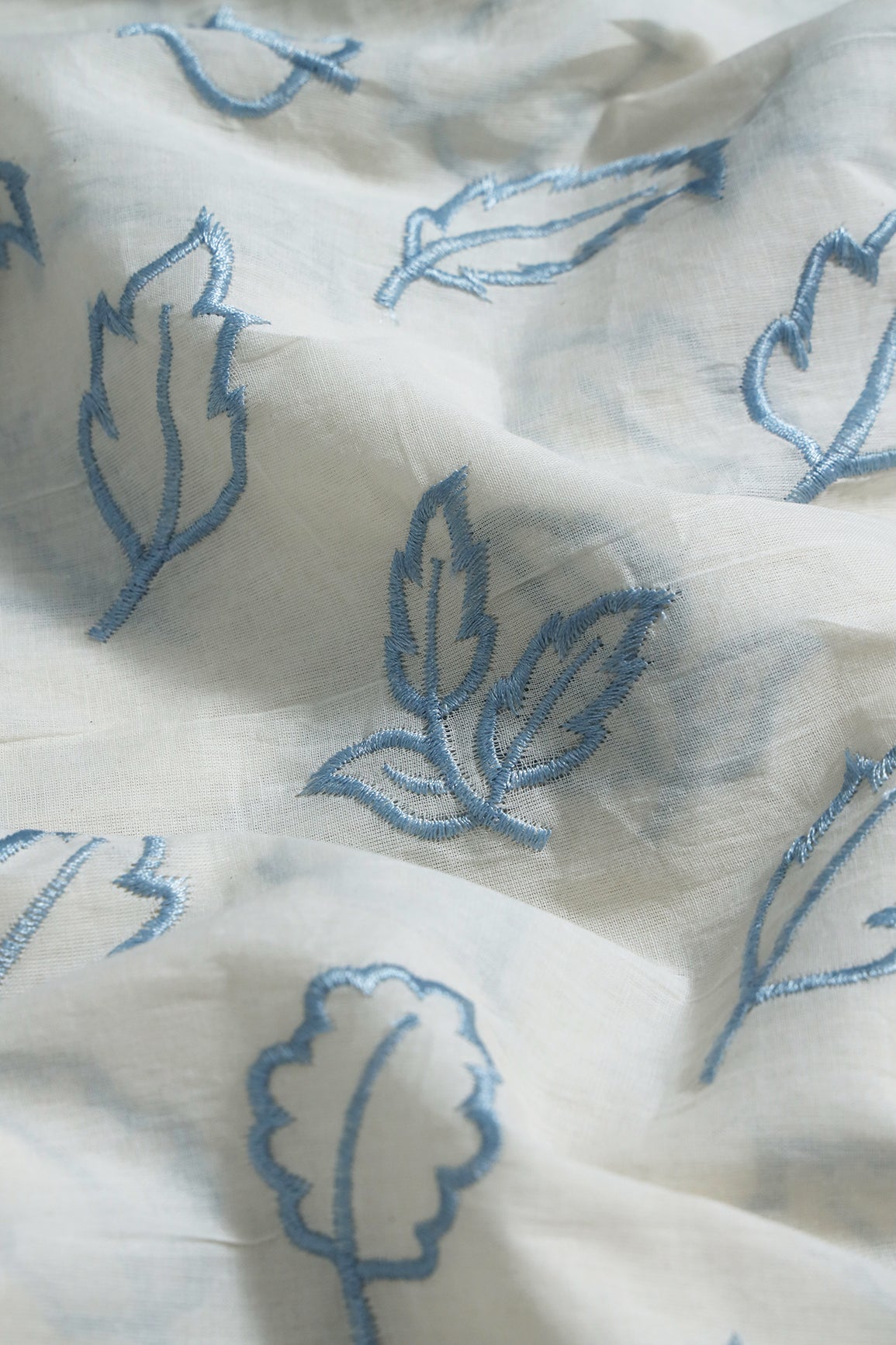 AIzaSyBcstauz-XMPRhEY21AUzeo032pxrXB5Ug - Beautiful Blue Leafy Embroidery On Off White Organic Cotton Fabric