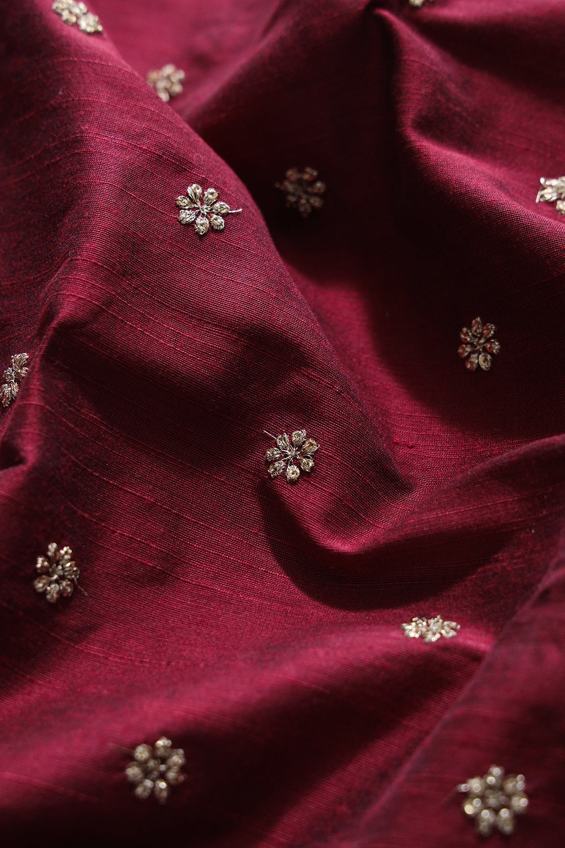 AIzaSyBcstauz-XMPRhEY21AUzeo032pxrXB5Ug - Gold Sequins With Gold Zari Small Motif Embroidery Work On Maroon Raw Silk Fabric