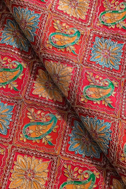 Positional Print With Sequins And Traditional Embroidery On Red And Rani Crepe Fabric
