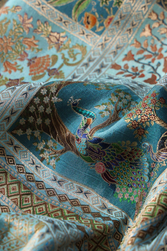 Positional Floral Print On Pastel Blue Viscose Dola Silk Jacquard Fabric