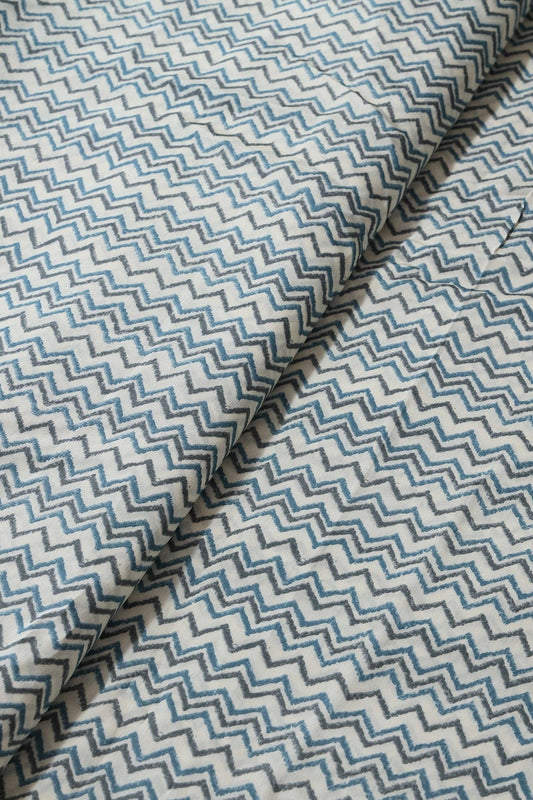 AIzaSyBcstauz-XMPRhEY21AUzeo032pxrXB5Ug - Azzure Blue And Grey Chevron Print On Cream Viscose Chanderi Silk Fabric