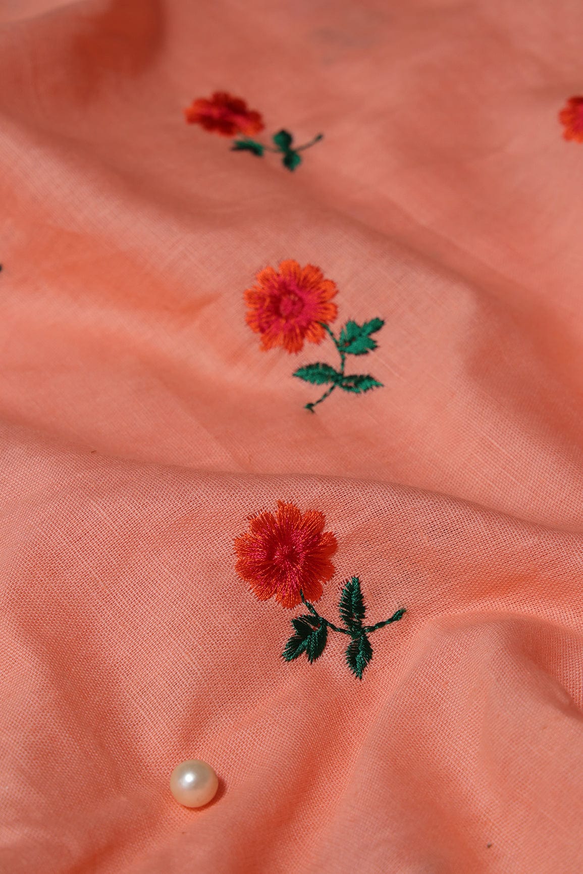 AIzaSyBcstauz-XMPRhEY21AUzeo032pxrXB5Ug - Beautiful Dark Orange And Green Floral Embroidery Work On Peach Pure Cotton Fabric