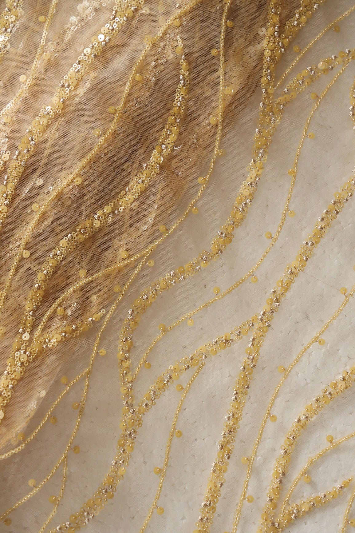 AIzaSyBcstauz-XMPRhEY21AUzeo032pxrXB5Ug - Beautiful Sequins With Beige Thread Wavy Embroidery Work On Beige Soft Net Fabric