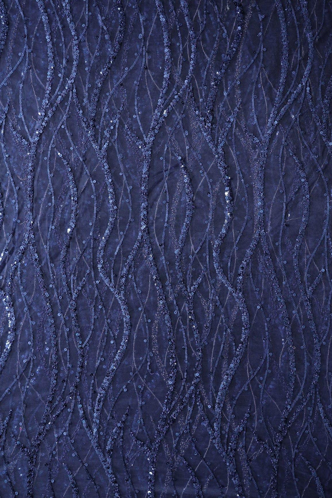 AIzaSyBcstauz-XMPRhEY21AUzeo032pxrXB5Ug - Beautiful Sequins With Blue Thread Wavy Embroidery Work On Navy Blue Soft Net Fabric