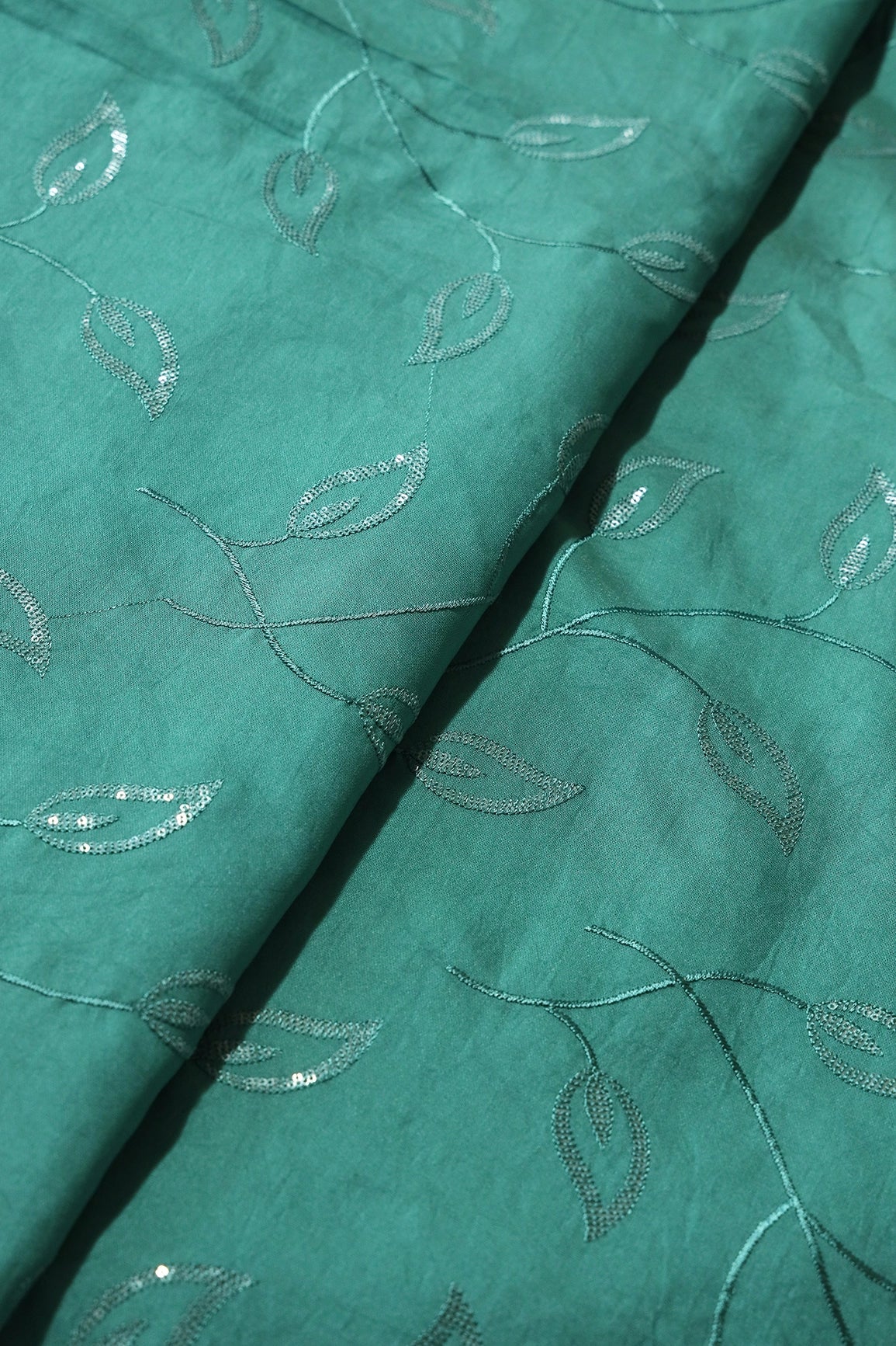 AIzaSyBcstauz-XMPRhEY21AUzeo032pxrXB5Ug - Beautiful Water Sequins Leafy Embroidery On Teal Pure Chanderi Silk Fabric
