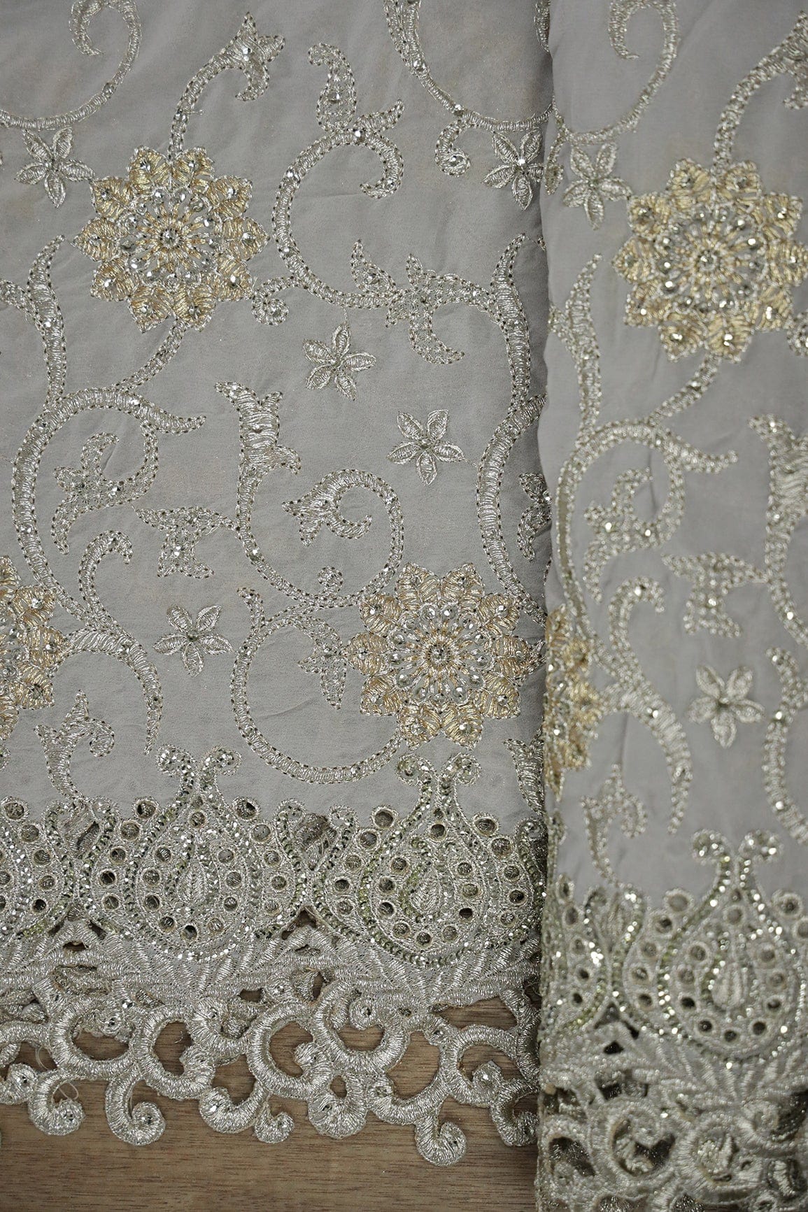 AIzaSyBcstauz-XMPRhEY21AUzeo032pxrXB5Ug - Big Width''56'' Gold And Silver Zari Floral Embroidery Work On Grey Georgette Fabric With Border