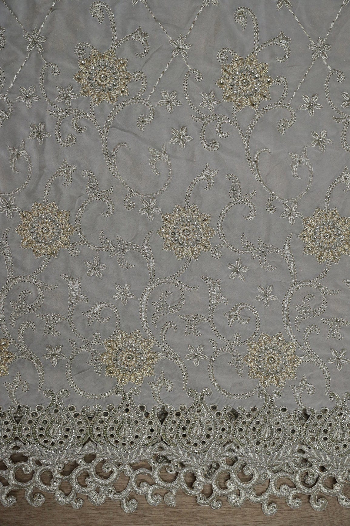 AIzaSyBcstauz-XMPRhEY21AUzeo032pxrXB5Ug - Big Width''56'' Gold And Silver Zari Floral Embroidery Work On Grey Georgette Fabric With Border