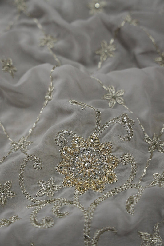 AIzaSyBcstauz-XMPRhEY21AUzeo032pxrXB5Ug - Big Width''56'' Gold And Silver Zari Floral Embroidery Work On Grey Georgette Fabric With Border
