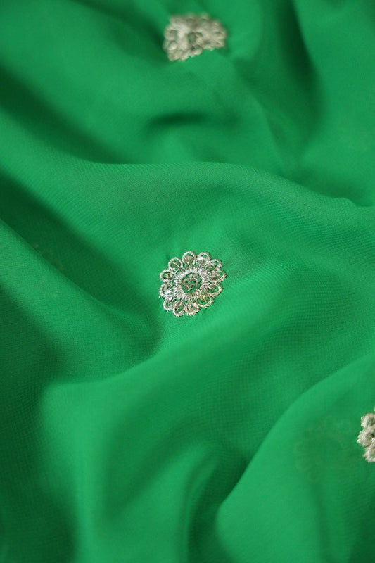 AIzaSyBcstauz-XMPRhEY21AUzeo032pxrXB5Ug - Big Width''56'' Silver Zari Leafy Embroidery Work On Green Georgette Fabric With Border