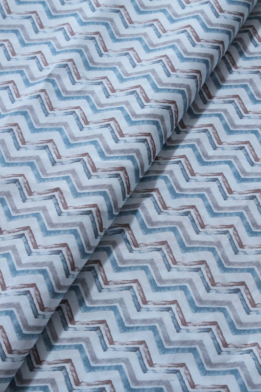 AIzaSyBcstauz-XMPRhEY21AUzeo032pxrXB5Ug - Blue And Brown Chevron Print On Pastel Blue Viscose Chanderi Silk Fabric