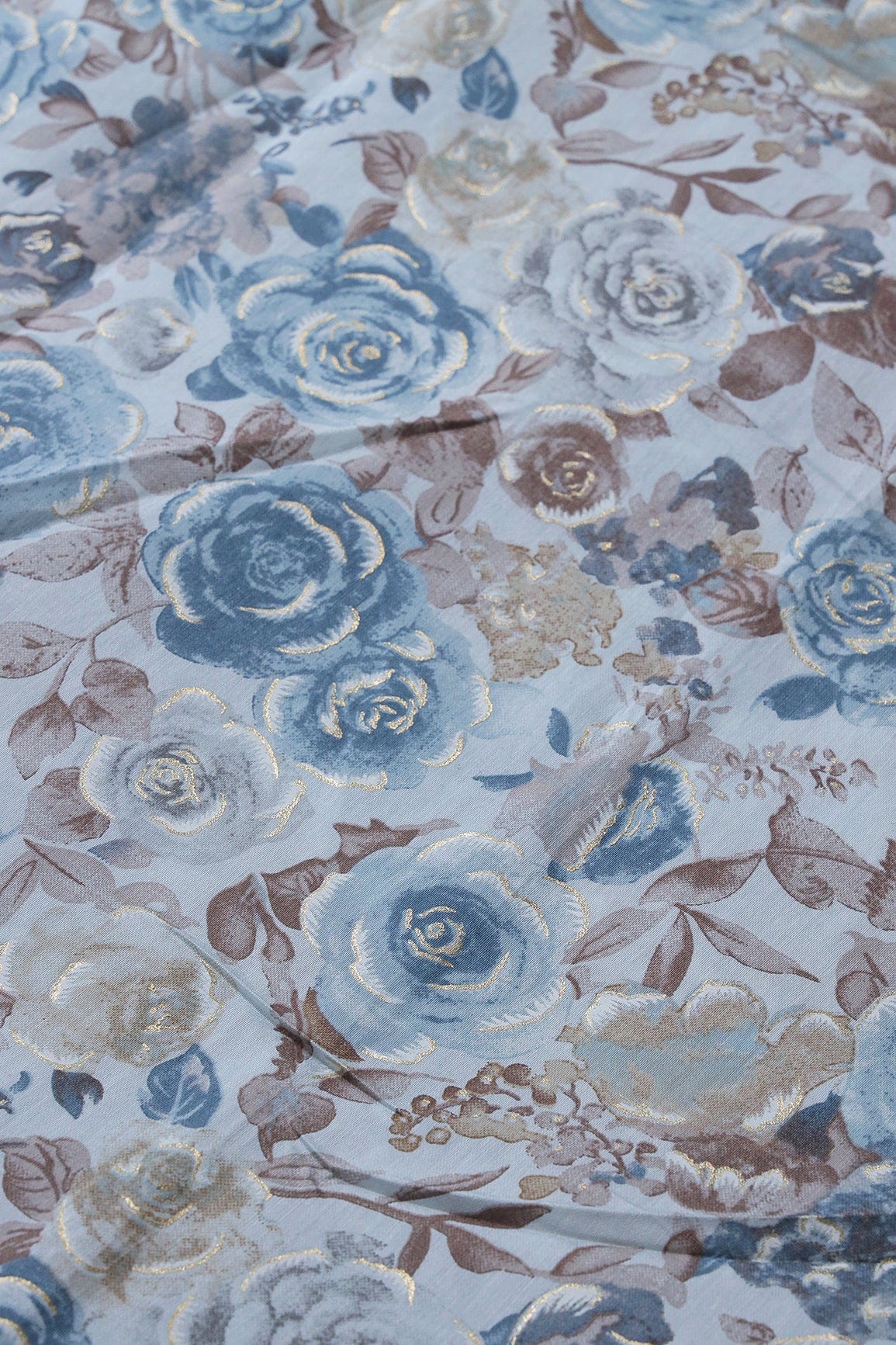 AIzaSyBcstauz-XMPRhEY21AUzeo032pxrXB5Ug - Blue And Brown Floral Foil Print On Pastel Blue Viscose Chanderi Silk Fabric