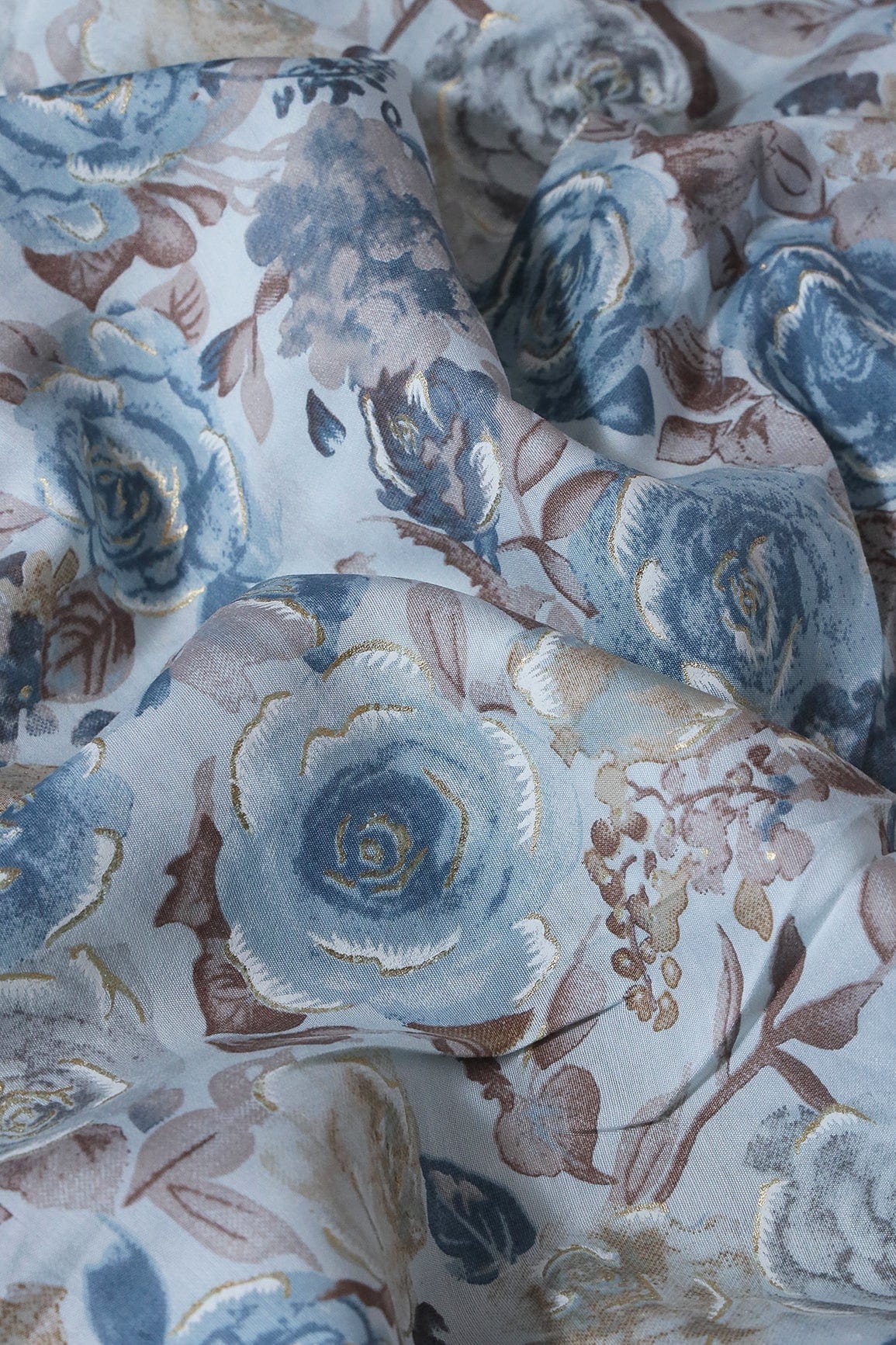 AIzaSyBcstauz-XMPRhEY21AUzeo032pxrXB5Ug - Blue And Brown Floral Foil Print On Pastel Blue Viscose Chanderi Silk Fabric