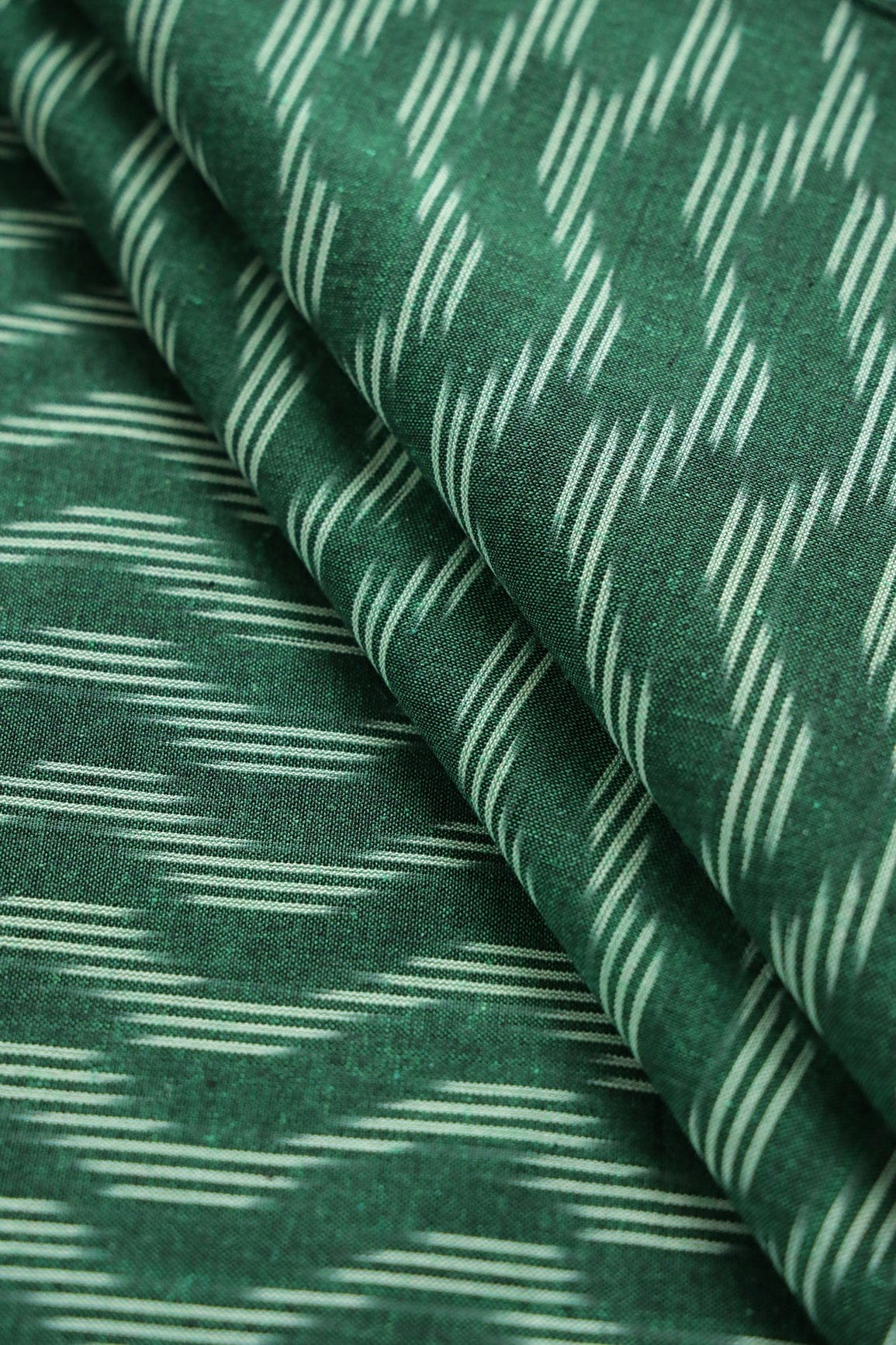 AIzaSyBcstauz-XMPRhEY21AUzeo032pxrXB5Ug - Bottle Green And Cream Chevron Pattern Handwoven Ikat Organic Cotton Fabric