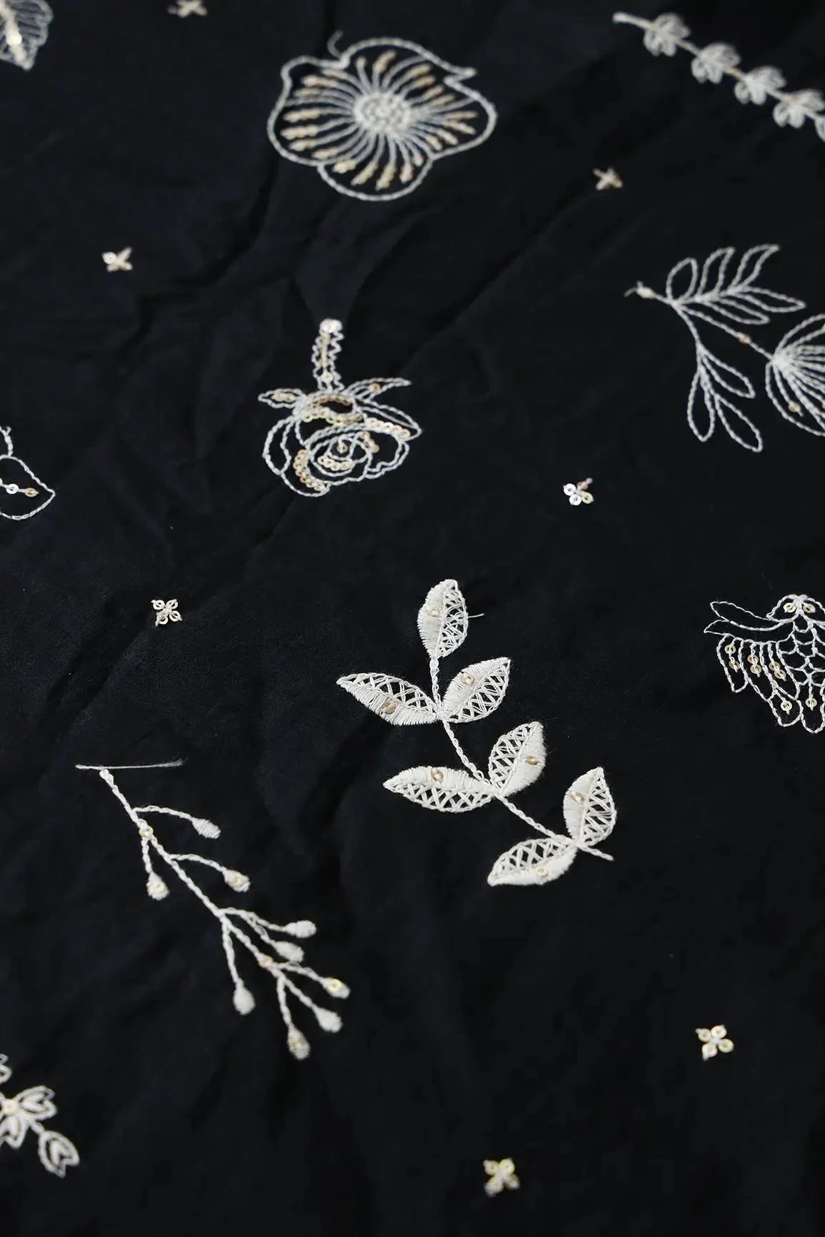 AIzaSyBcstauz-XMPRhEY21AUzeo032pxrXB5Ug - Cream Thread With Gold Sequins Floral Embroidery Work On Black Cotton Cambric Fabric