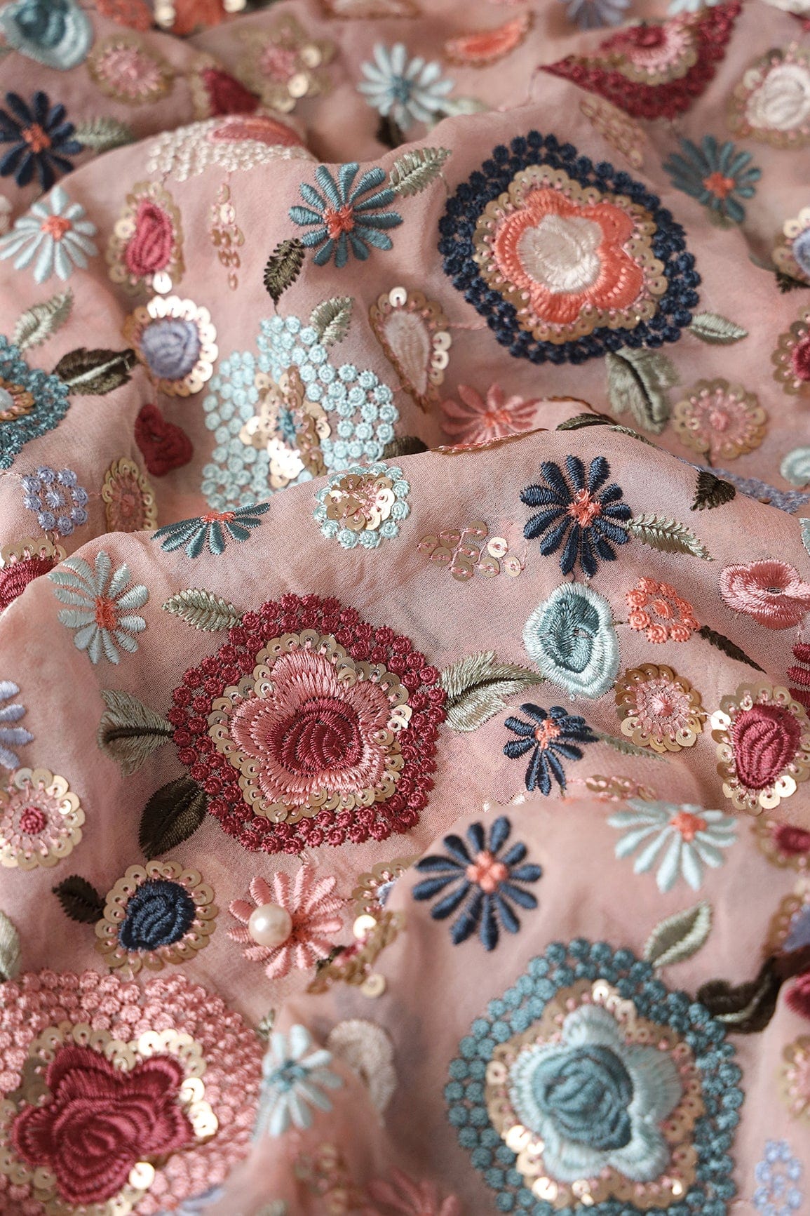 AIzaSyBcstauz-XMPRhEY21AUzeo032pxrXB5Ug - Elegant Floral Heavy Embroidery With Gold Sequins On Peach Viscose Georgette Fabric