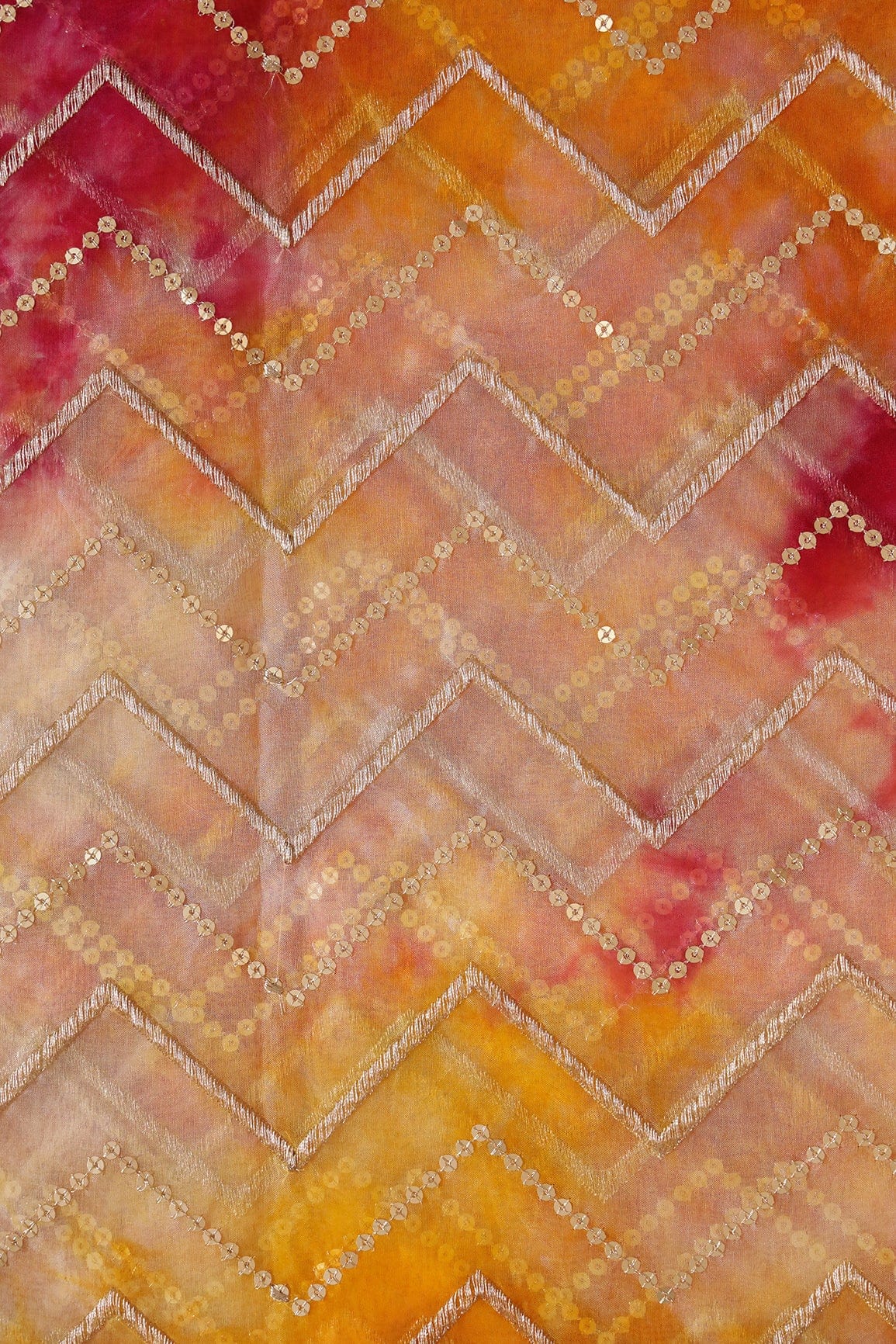 AIzaSyBcstauz-XMPRhEY21AUzeo032pxrXB5Ug - Gold Zari With Gold Sequins Chevron Embroidery Work On Tie & Dye Dark Pink And Yellow Organza Fabric