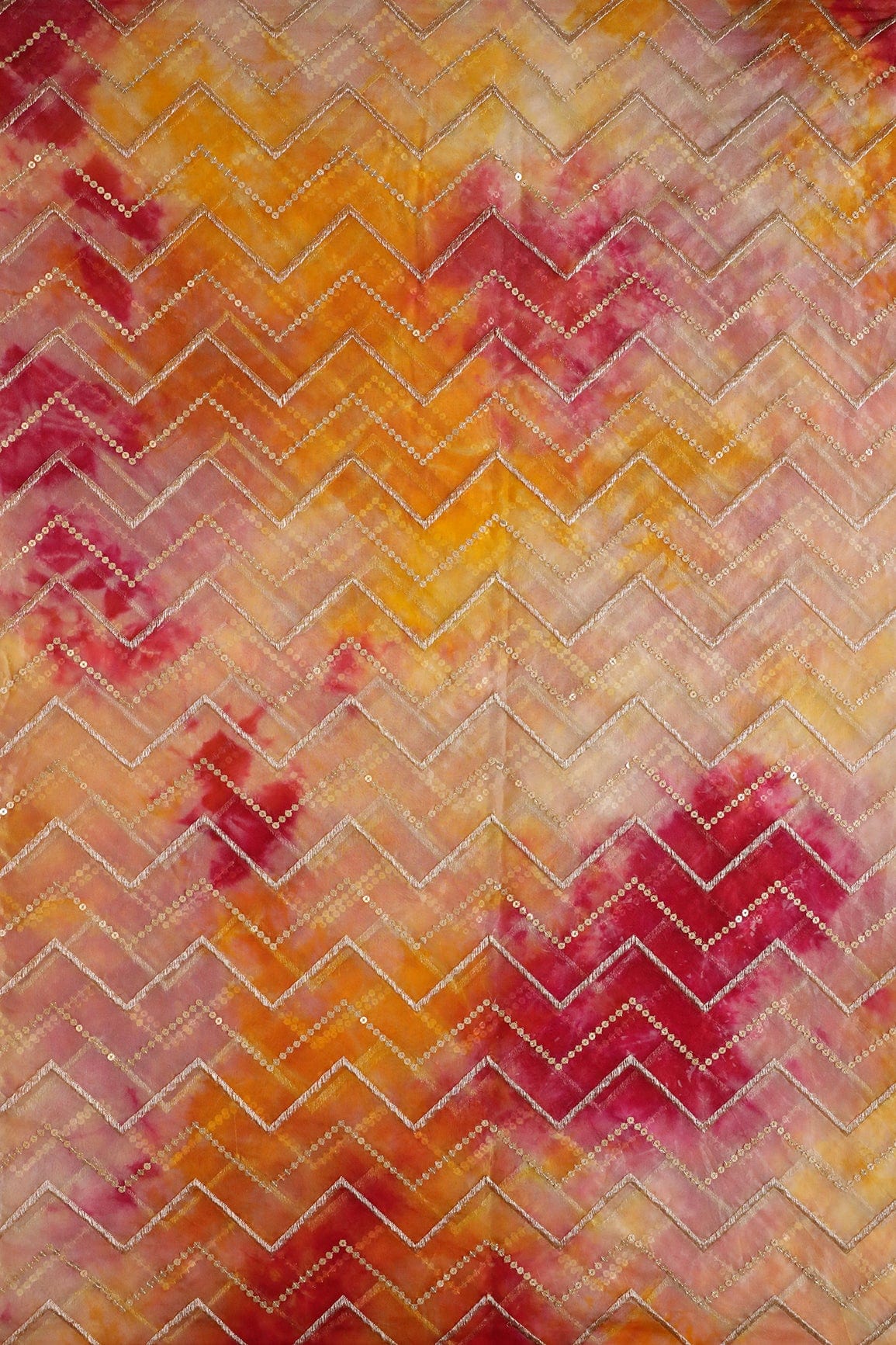AIzaSyBcstauz-XMPRhEY21AUzeo032pxrXB5Ug - Gold Zari With Gold Sequins Chevron Embroidery Work On Tie & Dye Dark Pink And Yellow Organza Fabric