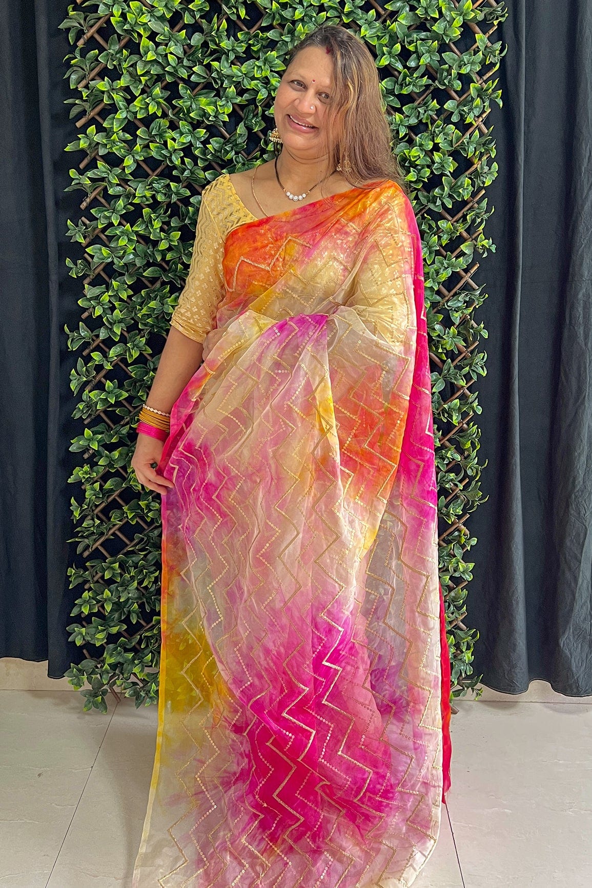 AIzaSyBcstauz-XMPRhEY21AUzeo032pxrXB5Ug - Gold Zari With Gold Sequins Chevron Embroidery Work On Tie & Dye Dark Pink And Yellow Organza Fabric