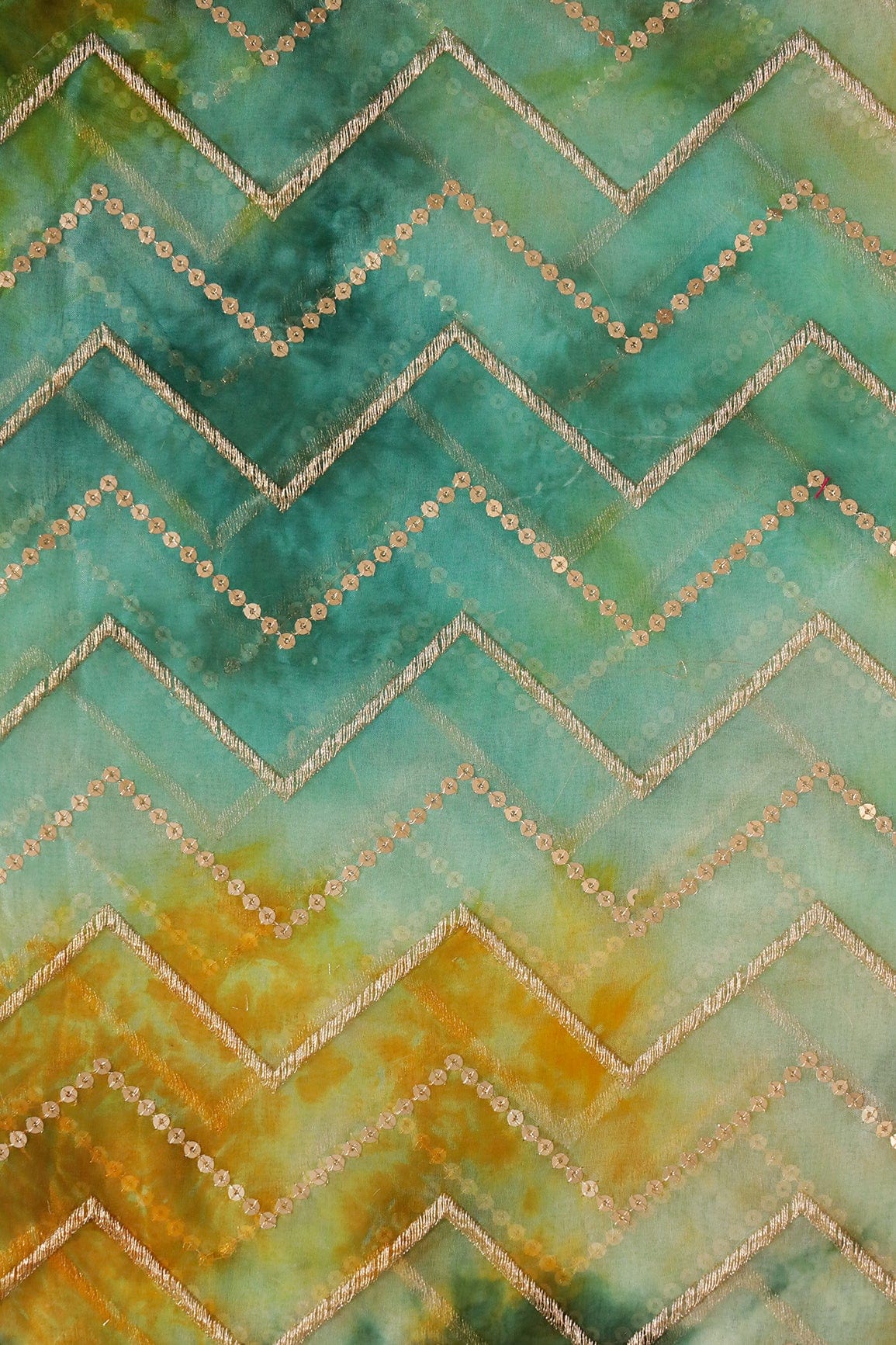 AIzaSyBcstauz-XMPRhEY21AUzeo032pxrXB5Ug - Gold Zari With Gold Sequins Chevron Embroidery Work On Tie & Dye Teal And Green Organza Fabric