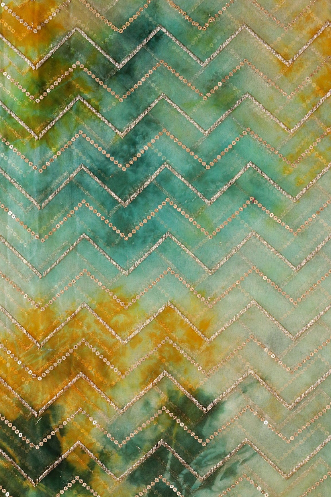 AIzaSyBcstauz-XMPRhEY21AUzeo032pxrXB5Ug - Gold Zari With Gold Sequins Chevron Embroidery Work On Tie & Dye Teal And Green Organza Fabric