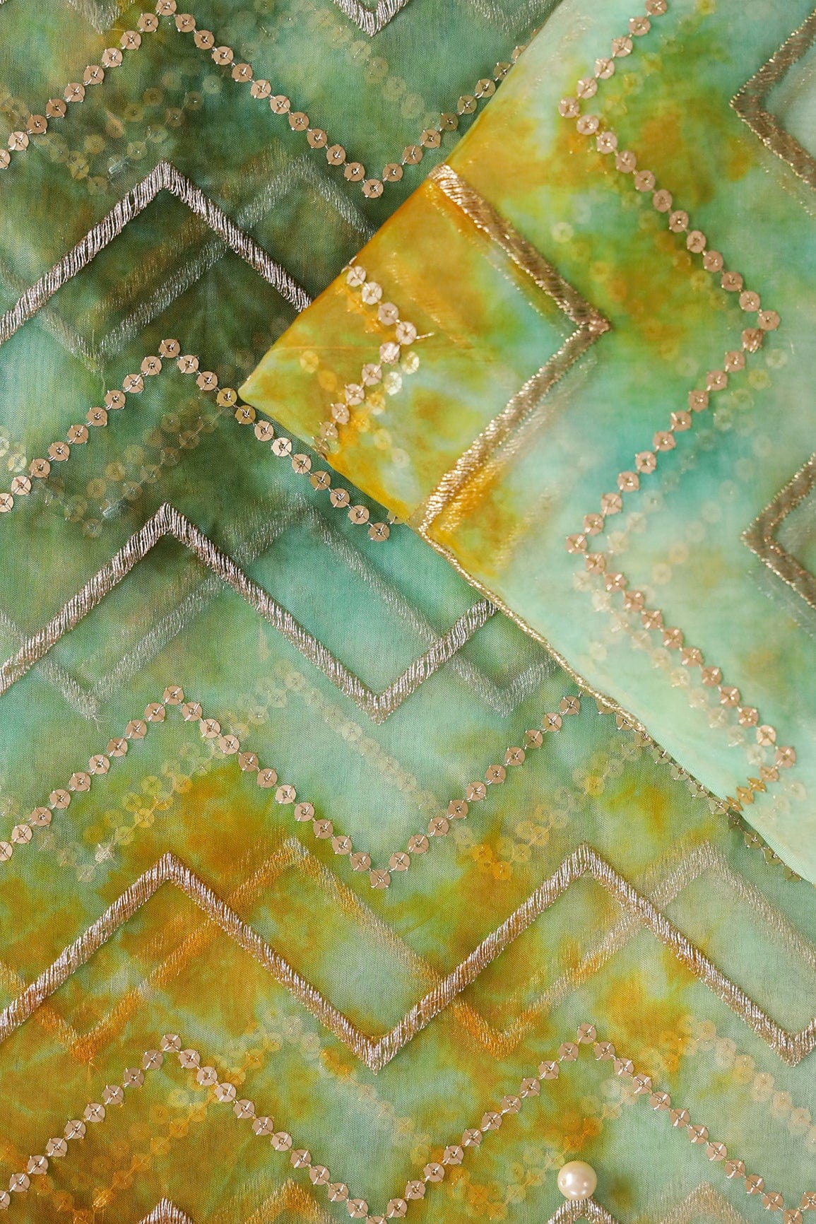 AIzaSyBcstauz-XMPRhEY21AUzeo032pxrXB5Ug - Gold Zari With Gold Sequins Chevron Embroidery Work On Tie & Dye Teal And Green Organza Fabric