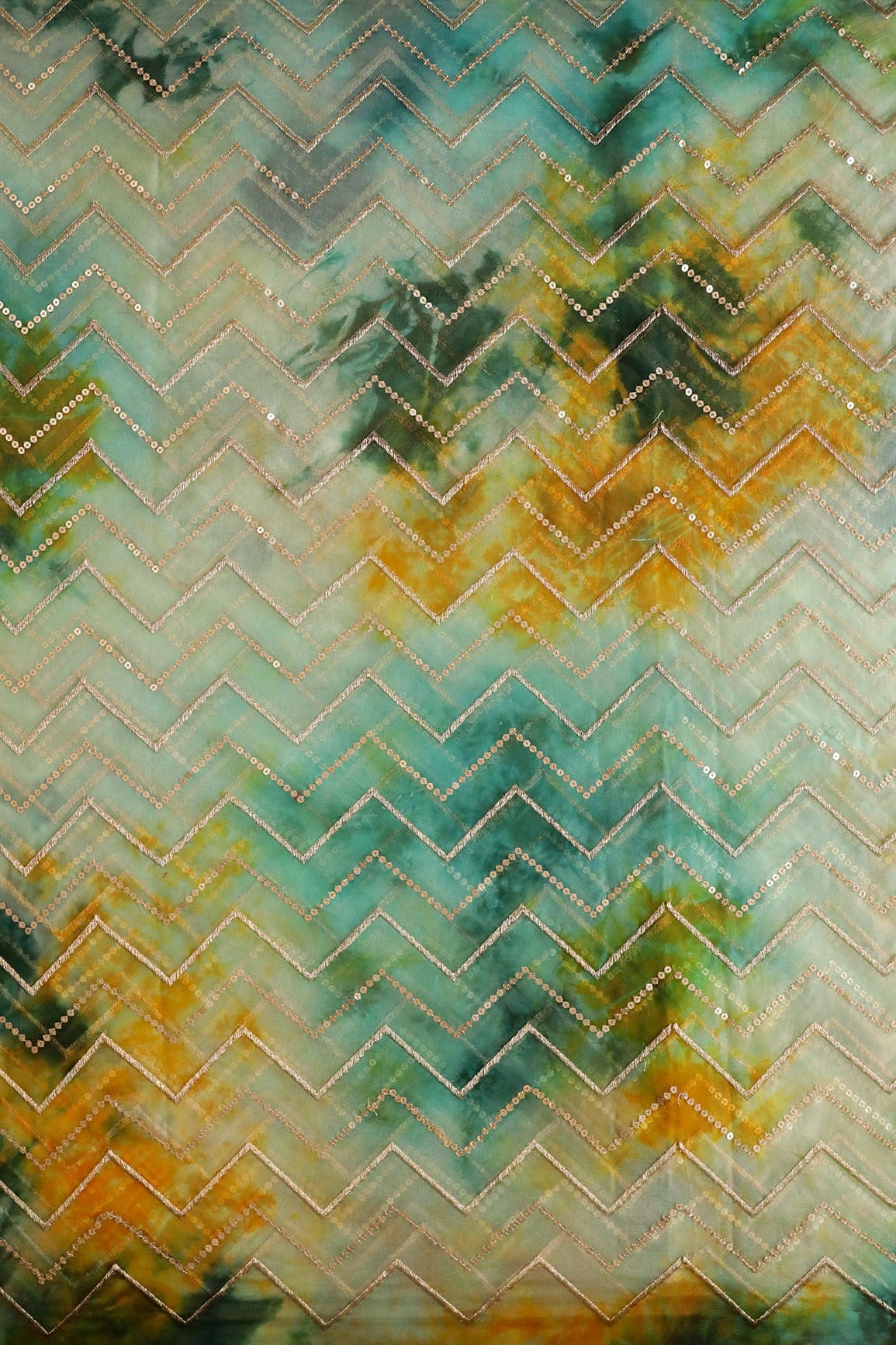 AIzaSyBcstauz-XMPRhEY21AUzeo032pxrXB5Ug - Gold Zari With Gold Sequins Chevron Embroidery Work On Tie & Dye Teal And Green Organza Fabric