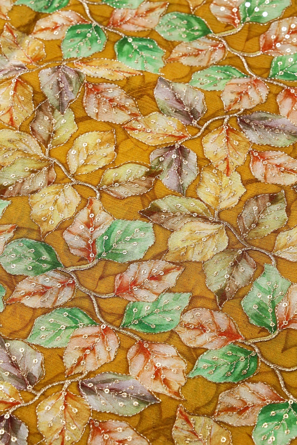 AIzaSyBcstauz-XMPRhEY21AUzeo032pxrXB5Ug - Exclusive Leafy Position Print On Sequins Embroidery Mustard Viscose Chinnon Chiffon Fabric