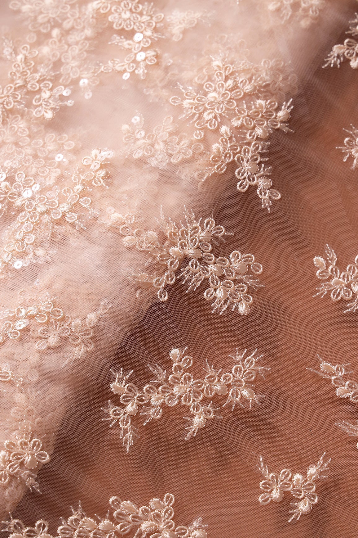 AIzaSyBcstauz-XMPRhEY21AUzeo032pxrXB5Ug - Exclusive Peach Thread With Sequins Abstract Embroidery Work On Light Peach Soft Net Fabric