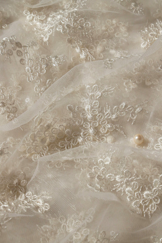 AIzaSyBcstauz-XMPRhEY21AUzeo032pxrXB5Ug - Exclusive White Thread With Sequins Abstract Embroidery Work On Dyeable White Soft Net Fabric