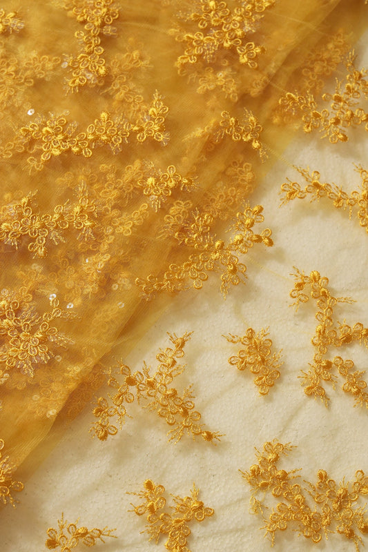 AIzaSyBcstauz-XMPRhEY21AUzeo032pxrXB5Ug - Exclusive Yellow Thread With Sequins Abstract Embroidery Work On Mustard Yellow Soft Net Fabric