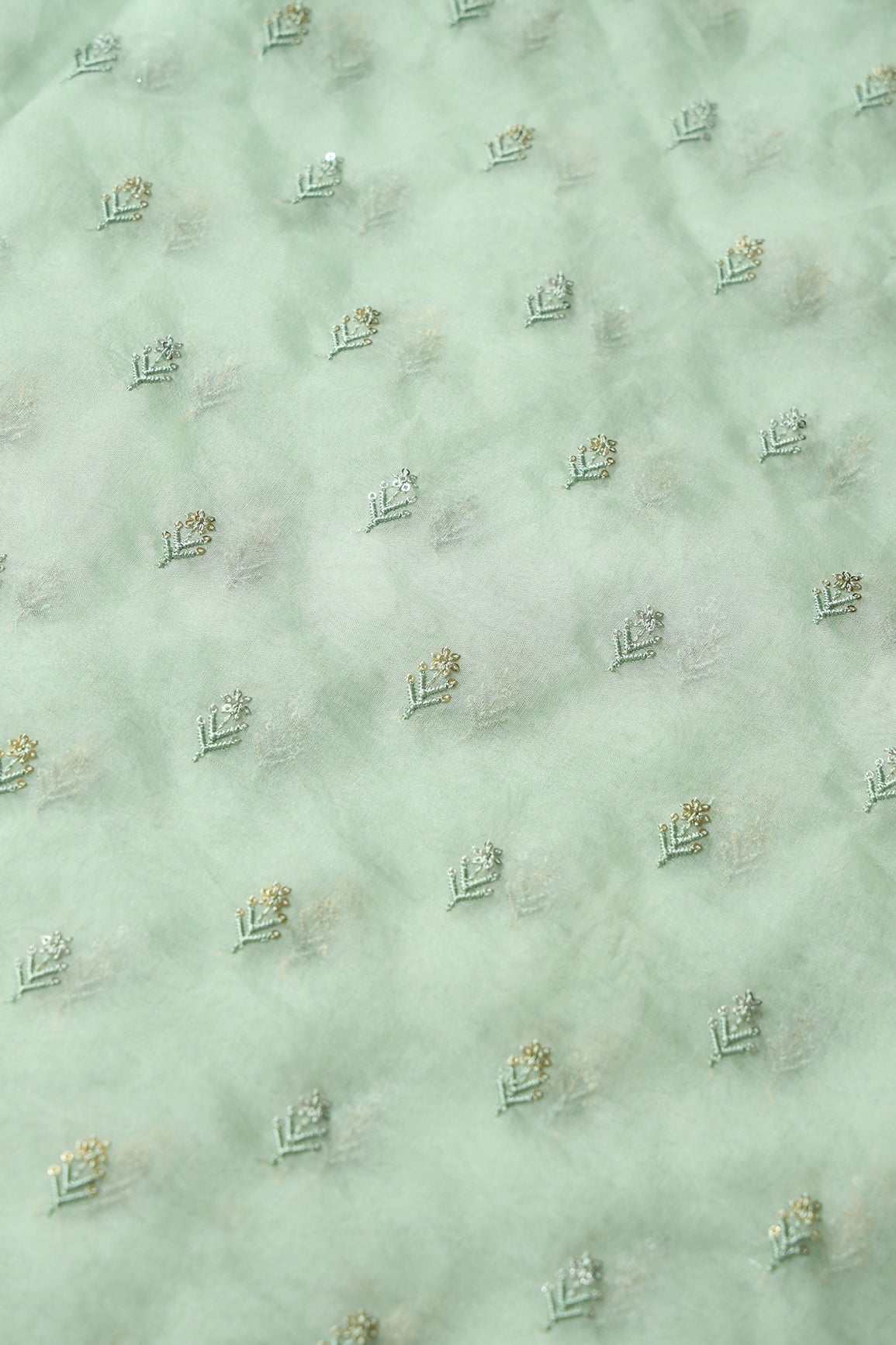 AIzaSyBcstauz-XMPRhEY21AUzeo032pxrXB5Ug - Gold And Silver Sequins Beautiful Small Floral Motif Embroidery Work On Pastel Olive Organza Fabric