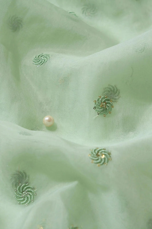 AIzaSyBcstauz-XMPRhEY21AUzeo032pxrXB5Ug - Gold And Silver Sequins Beautiful Small Motif Embroidery Work On Pastel Olive Organza Fabric