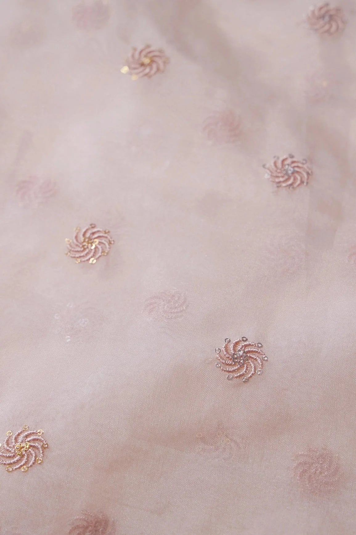 AIzaSyBcstauz-XMPRhEY21AUzeo032pxrXB5Ug - Gold And Silver Sequins Beautiful Small Motif Embroidery Work On Pastel Peach Organza Fabric