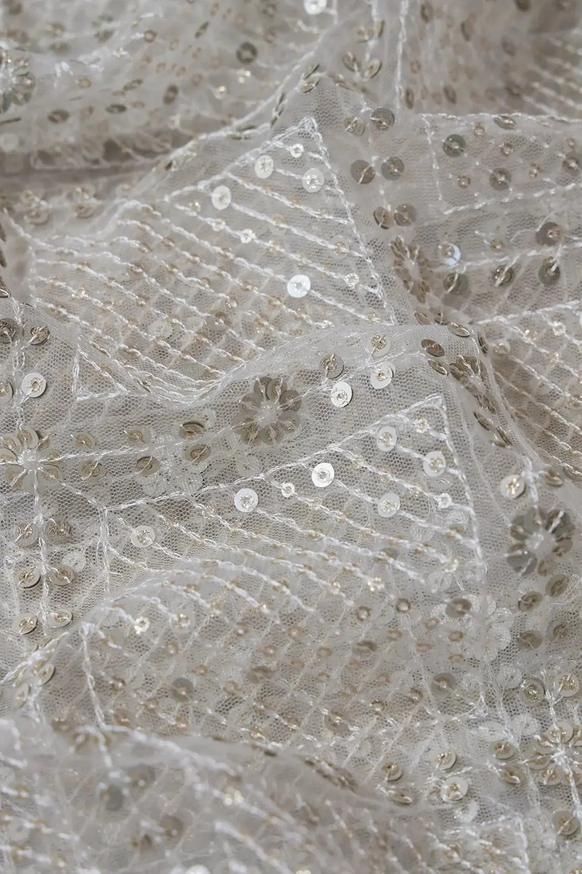 AIzaSyBcstauz-XMPRhEY21AUzeo032pxrXB5Ug - Gold And Silver Sequins Checks Embroidery On Dyeable White Soft Net Fabric