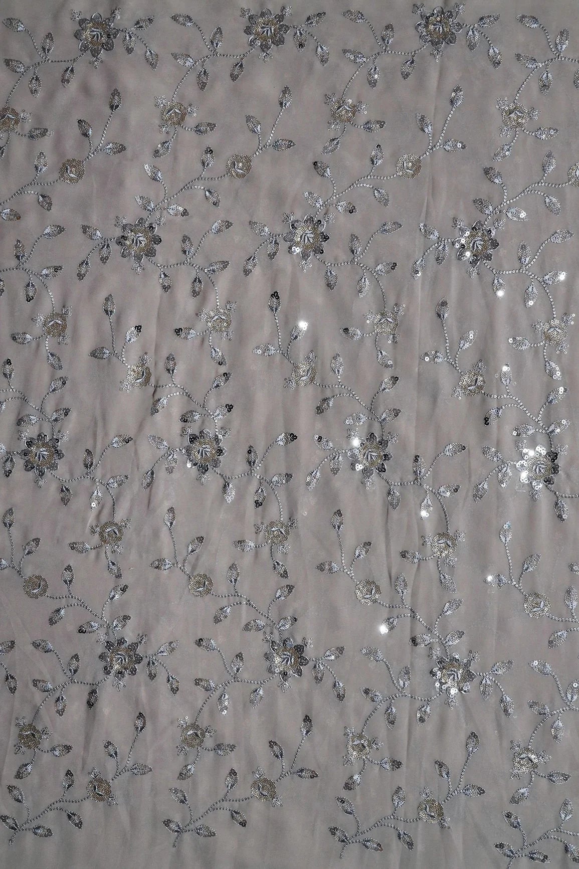 AIzaSyBcstauz-XMPRhEY21AUzeo032pxrXB5Ug - Gold And Silver Sequins Floral Embroidery Work On Grey Georgette Fabric