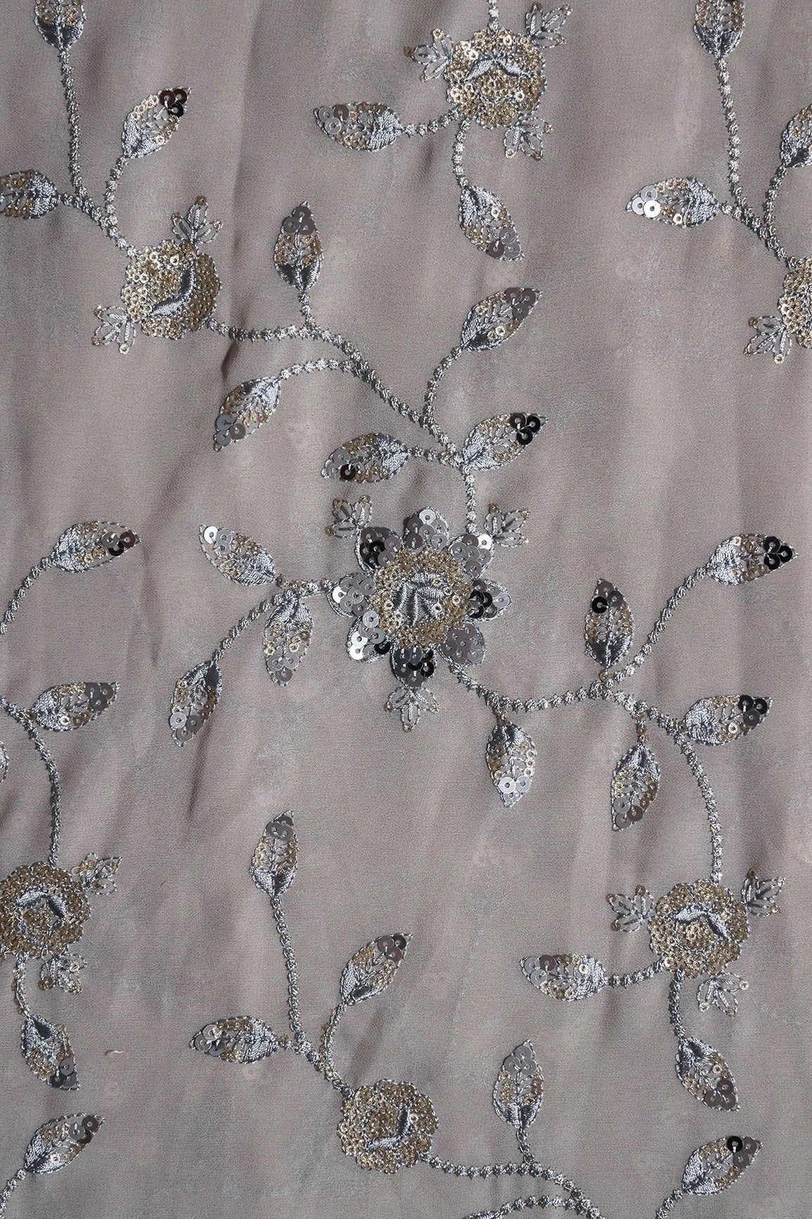 AIzaSyBcstauz-XMPRhEY21AUzeo032pxrXB5Ug - Gold And Silver Sequins Floral Embroidery Work On Grey Georgette Fabric