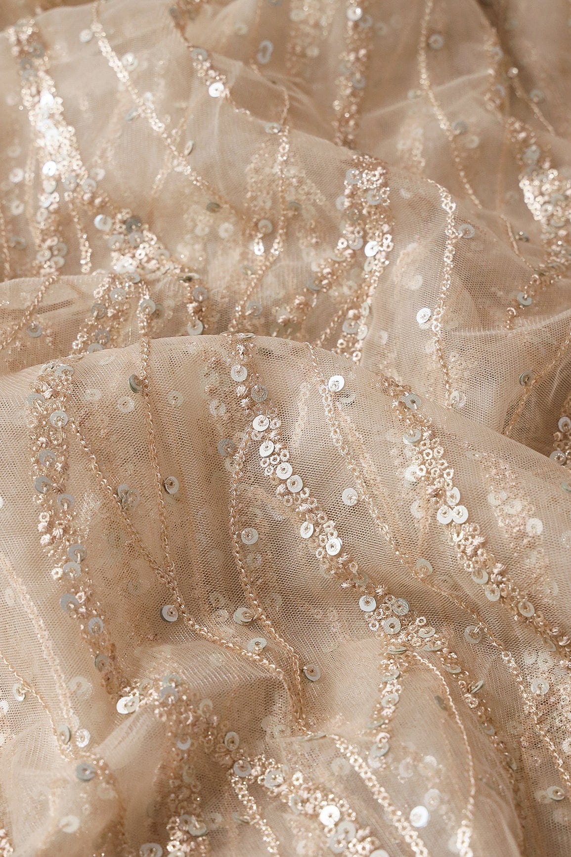 AIzaSyBcstauz-XMPRhEY21AUzeo032pxrXB5Ug - Gold And Silver Sequins With Beige Thread Wavy Embroidery On Light Beige Soft Net