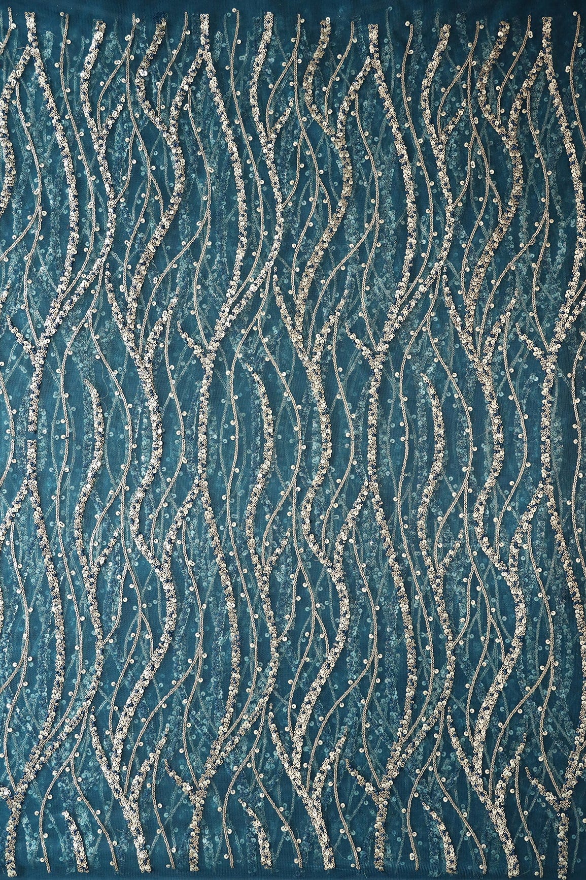 AIzaSyBcstauz-XMPRhEY21AUzeo032pxrXB5Ug - Gold And Silver Sequins With Blue Thread Wavy Embroidery Work On Rama Blue Soft Net Fabric