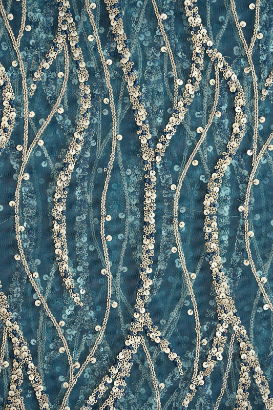 AIzaSyBcstauz-XMPRhEY21AUzeo032pxrXB5Ug - Gold And Silver Sequins With Blue Thread Wavy Embroidery Work On Rama Blue Soft Net Fabric