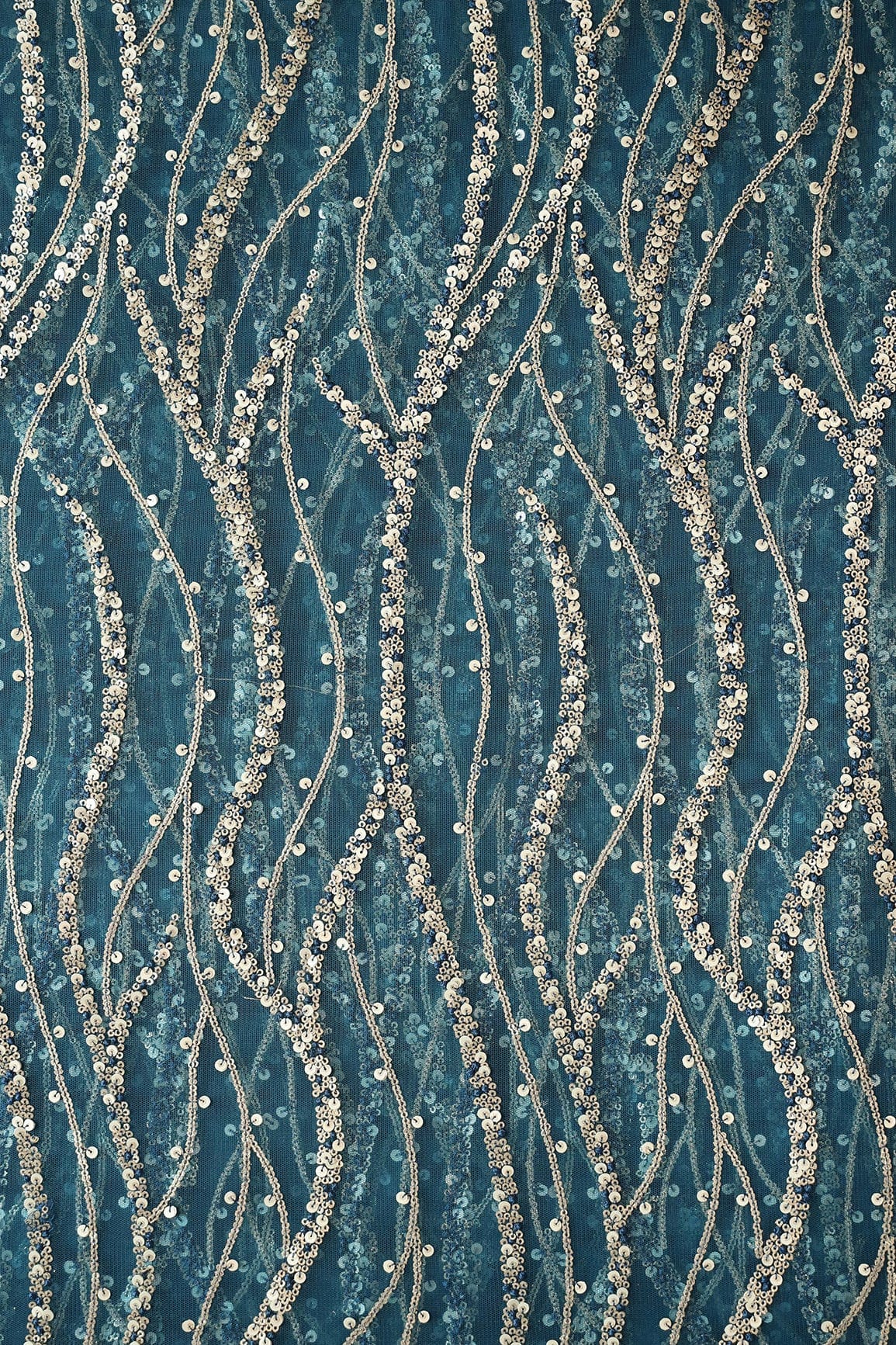AIzaSyBcstauz-XMPRhEY21AUzeo032pxrXB5Ug - Gold And Silver Sequins With Blue Thread Wavy Embroidery Work On Rama Blue Soft Net Fabric