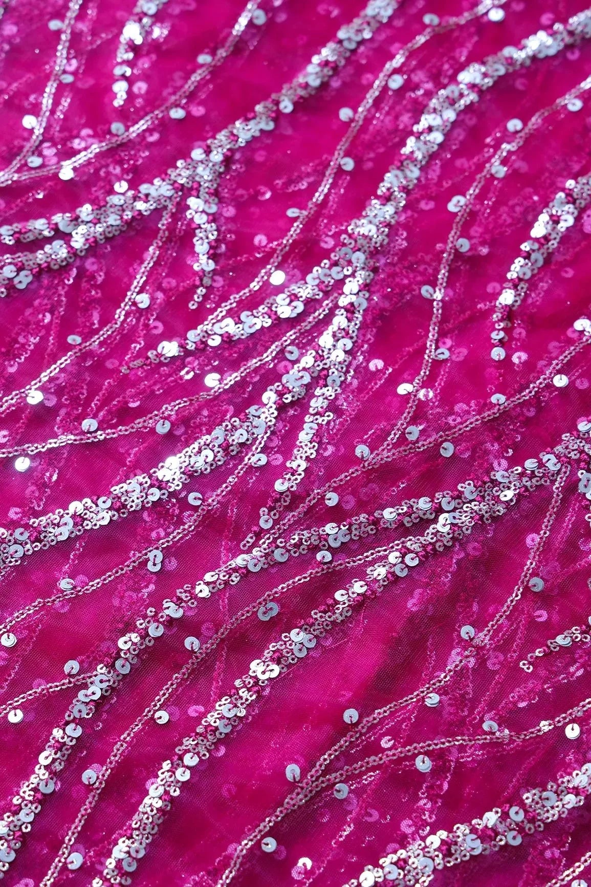 AIzaSyBcstauz-XMPRhEY21AUzeo032pxrXB5Ug - Gold And Silver Sequins With Fuchsia Thread Wavy Embroidery Work On Fuchsia Soft Net Fabric