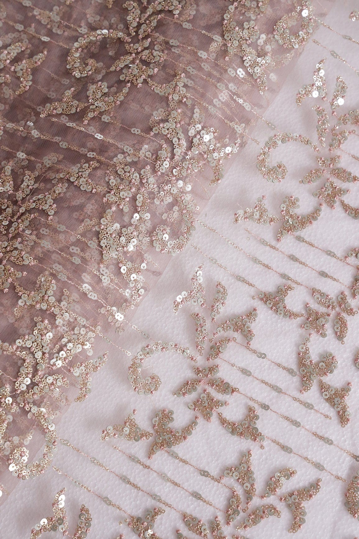 AIzaSyBcstauz-XMPRhEY21AUzeo032pxrXB5Ug - Gold And Silver Sequins With Mauve Thread Abstract Embroidery Work On Mauve Soft Net Fabric